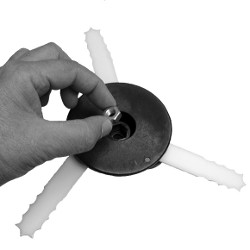 Shows how to install the nut on a bladed trimmer head.